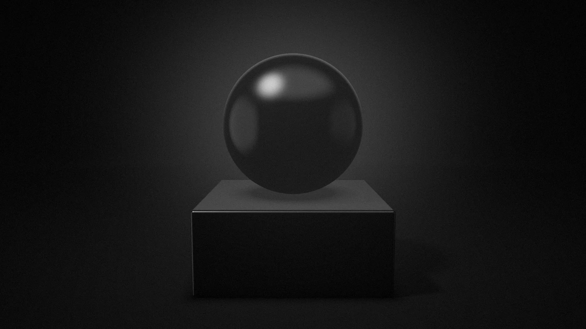 A black sphere resting on a plinth