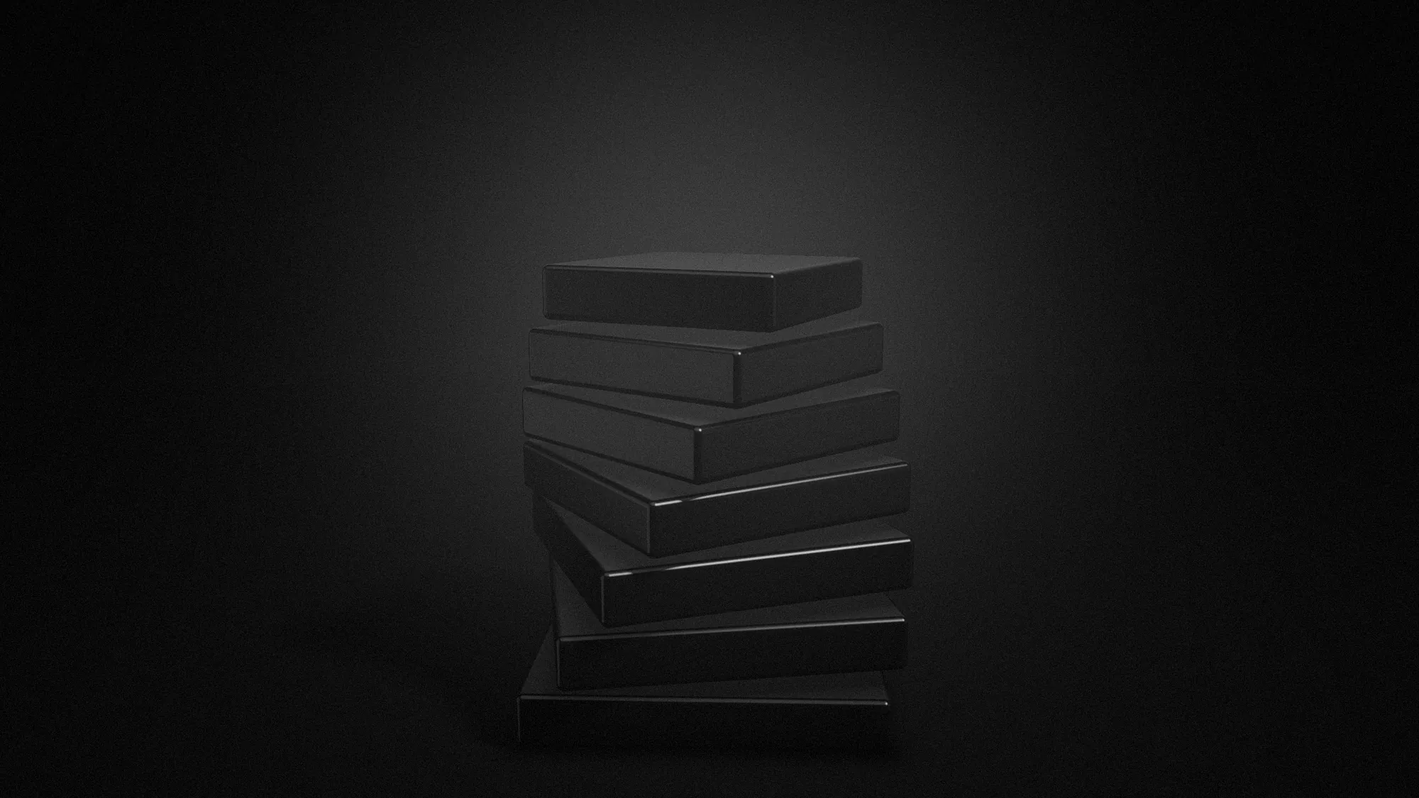 A tower of black plates, each turned a little further